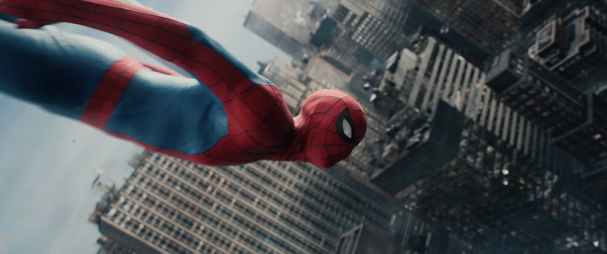 Tom Holland as Spider-Man swinging over NYC's skyscrapers.