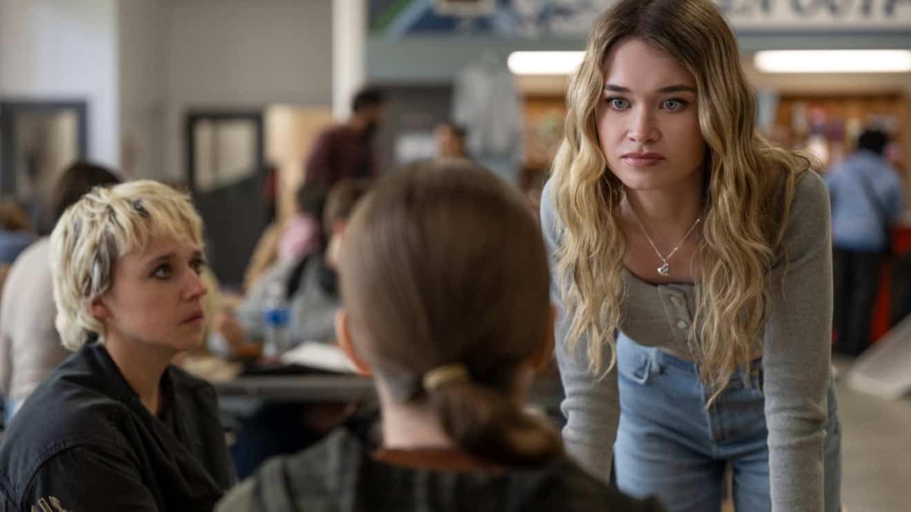 Alison Thornton as Chris Hargensen looks menacingly at Carrie, played by Summer H Lowell, as Thalia Dudek's character Emaline looks on in shock.